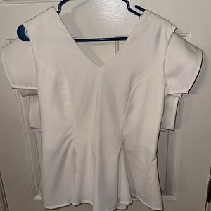 Fashionable white peplum blouse